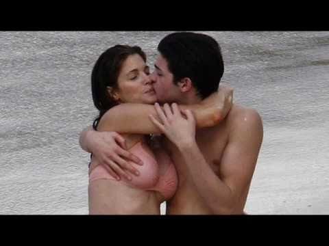 Stephanie Seymour in bikini kissing with her son