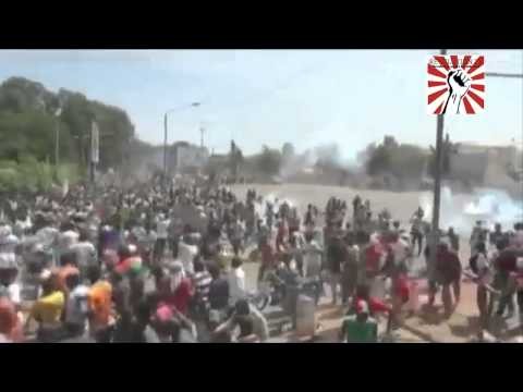 Burkina police fire tear gas into massive crowd