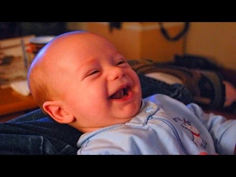 Cute babies laughing when the mother and father smiling