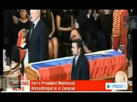 Ahmadinejad stands on the coffin of his friend Hugo Chavez while belarus ki