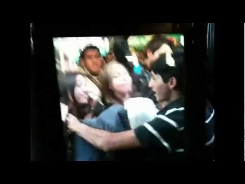 Crazy Girl attacks and pushes guy infront of a bus! (Lucky man)