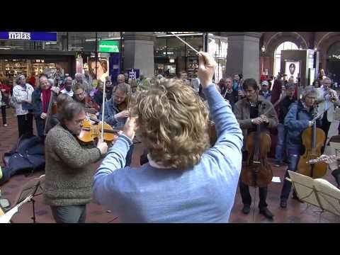 Flash mob at Copenhagen Central Station. Copenhagen Phil playing Ravel'