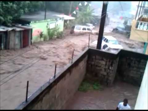 Cars washed away by heavy flooding in Dominica (TS Ophelia)