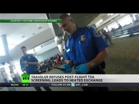 TSA officers try to screen passenger after his flight