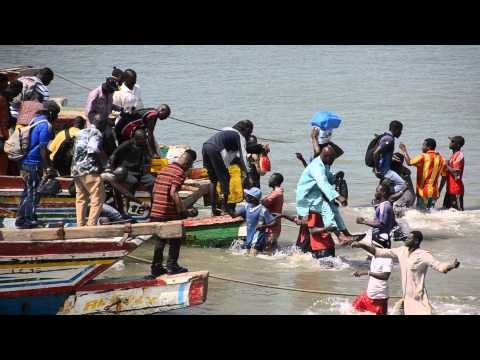 Unloading the local Gambian ferry - Banjul-Barra crossing- Gambia -