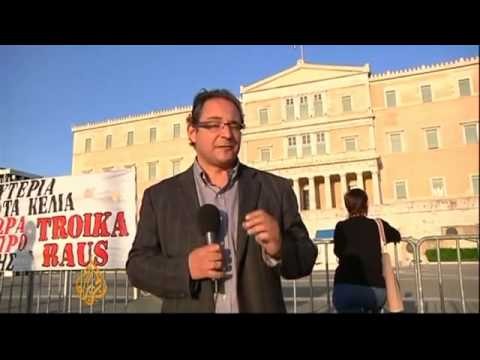 Greece parliament approves job cuts
