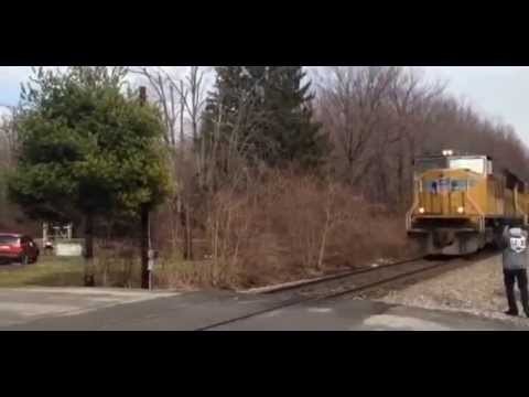 Horrific moment train crashes into car crossing tracks