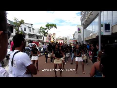 Brass band and dancers in front of Hotel Krasnapolsky - Paramaribo
