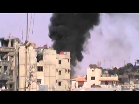 Syria Houses Burn as Assad Airplanes Drop Explosive Barrels on Homs City 6-