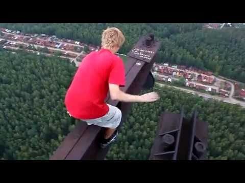 Crazy guy walks on the top of a very high carcass (MUST SEE!!!)